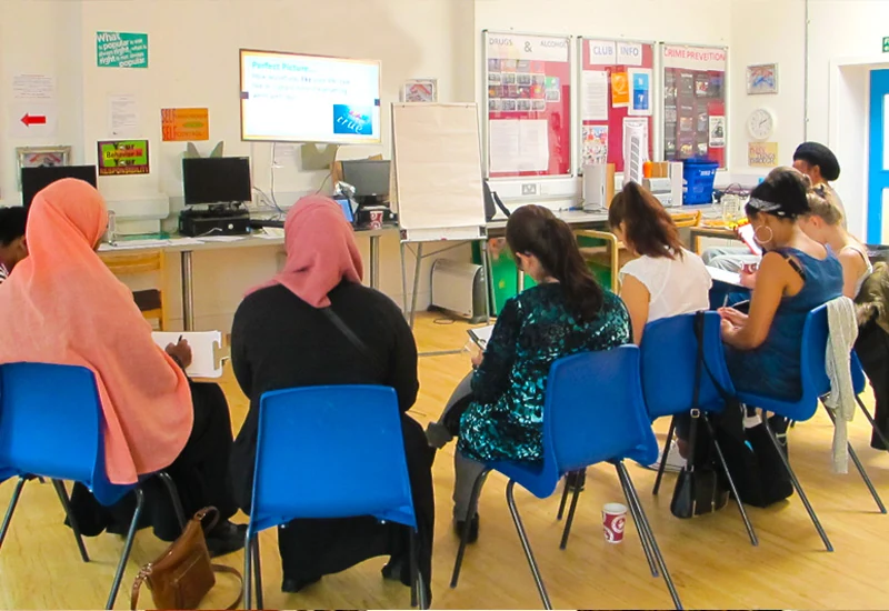 Adult learners attending a classroom session